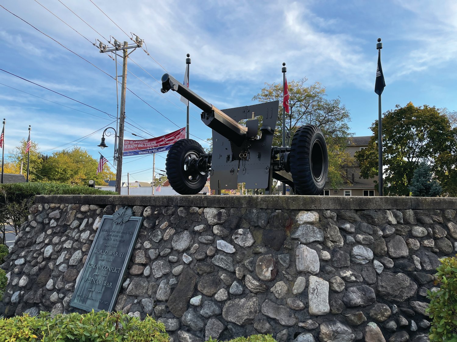 READY FOR A PARADE: The city’s first Veterans Day Parade in several years will proceed from the corner of Park and Doric avenues to the war memorial at the intersection of Rolfe Square, Park Avenue and Pontiac Avenue. A banner advertising the parade is seen behind the cannon at the memorial.